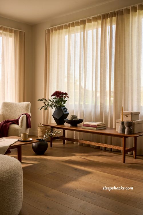 Modern fall decor ideas with black accents and rich autumn styling in a contemporary living room