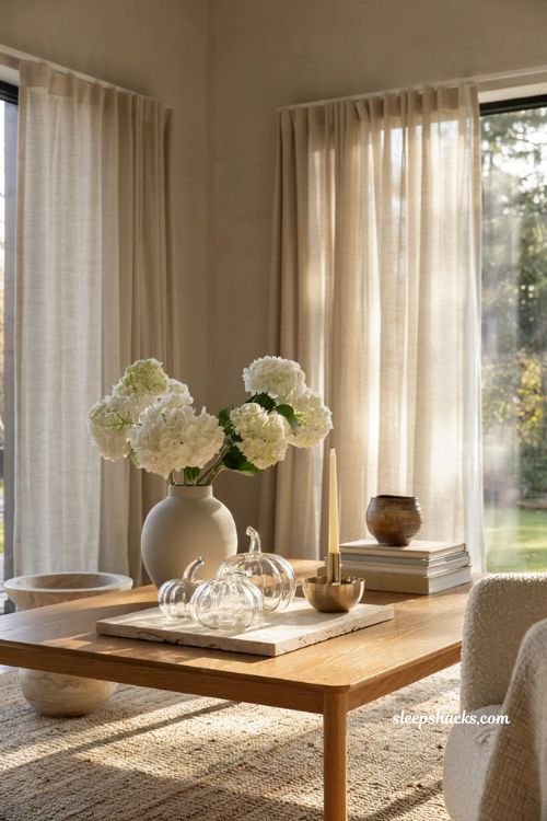 Modern fall decor ideas with elegant glass pumpkins and white hydrangeas