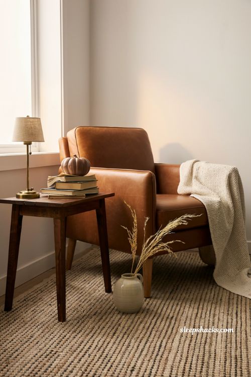 Modern fall decor with leather accent chair wood and cozy textures 