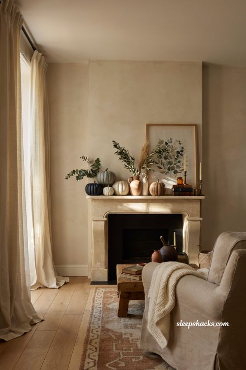 Painted pumpkin fall mantel with navy sage and elegant autumn decor