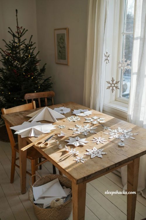 Paper snowflake Christmas crafts for kids with handmade winter decorations