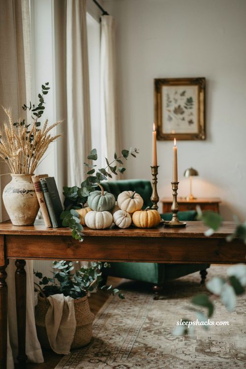 Pared back Halloween decor with white teal and pale yellow pumpkins