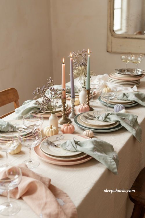 Pastel Halloween table setting with ghost plates lavender napkins and silver accents