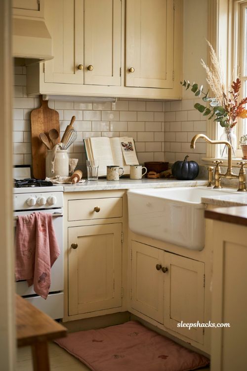 Pink Halloween kitchen towels and rug for cozy seasonal kitchen decor