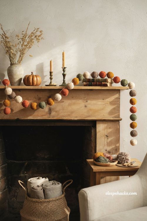 Pom pom fall garland with warm autumn colors for cozy mantel decor