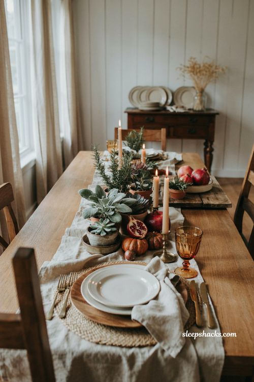 Potted plant centerpiece with pomegranates and gourds for Thanksgiving table decor