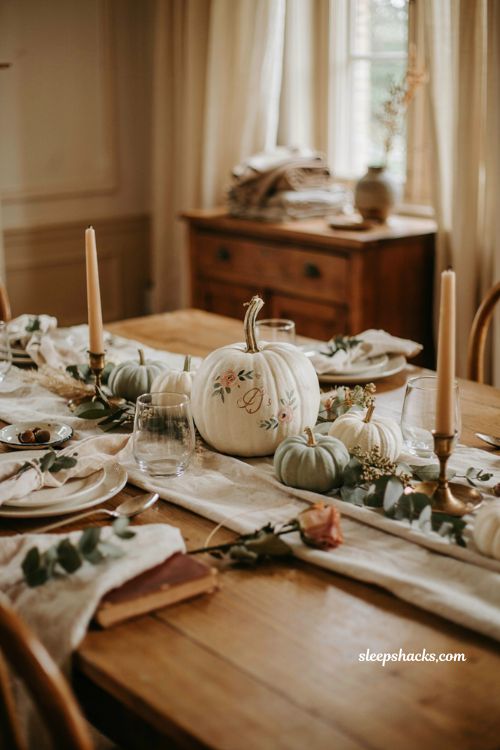 Pumpkin baby shower centerpiece with hand painted pumpkins and eucalyptus