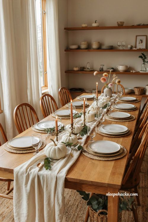 Pumpkin baby shower centerpiece with white pumpkins eucalyptus and cream table decor