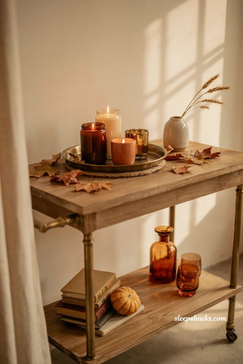 Pumpkin candle bar cart display with cozy farmhouse fall styling and layered autumn decor