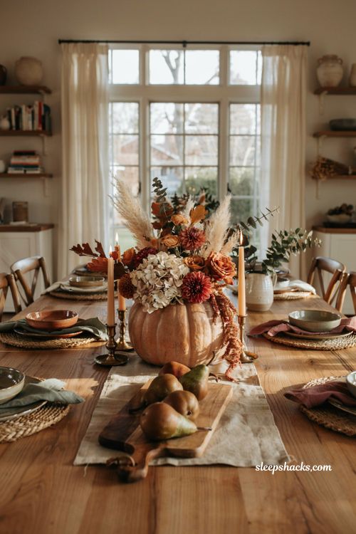 Pumpkin centerpieces fall with a faux pumpkin and realistic silk floral arrangement