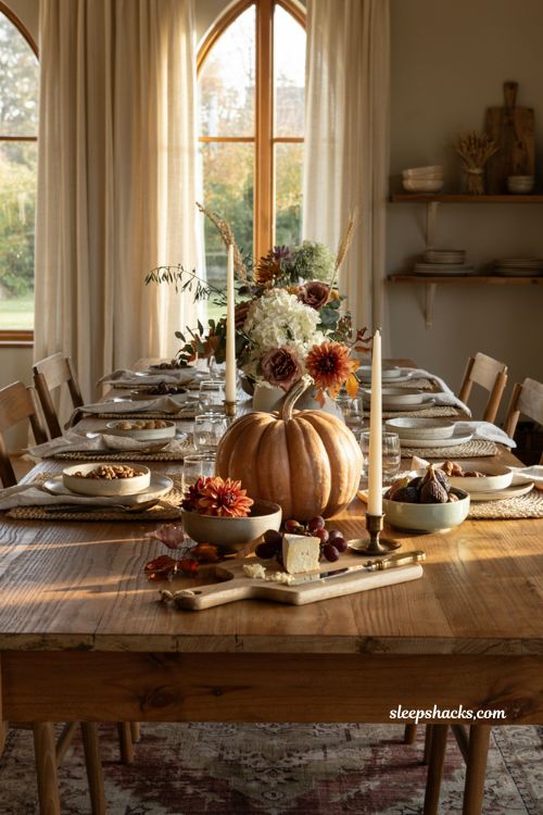 Pumpkin centerpieces fall with a large heirloom pumpkin arrangement on a farmhouse table