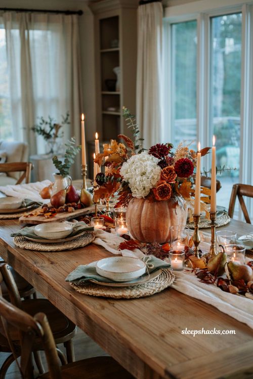 Pumpkin centerpieces fall with candlelight and floral pumpkins for a cozy Thanksgiving table