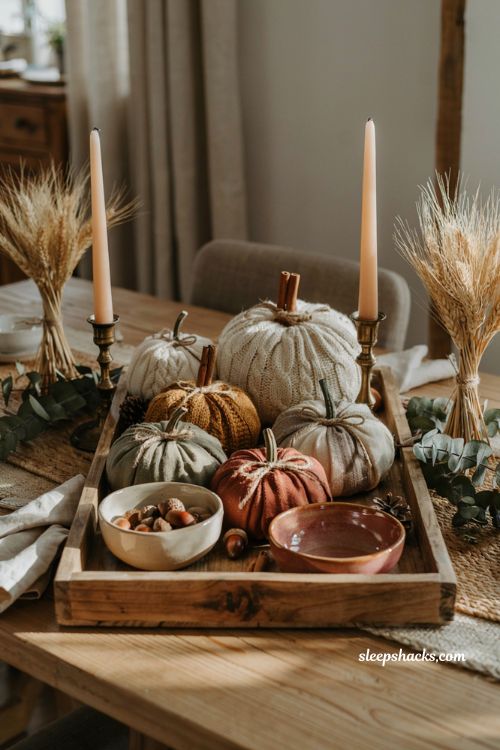 Pumpkin centerpieces fall with handmade sweater fabric pumpkins on a rustic wooden tray