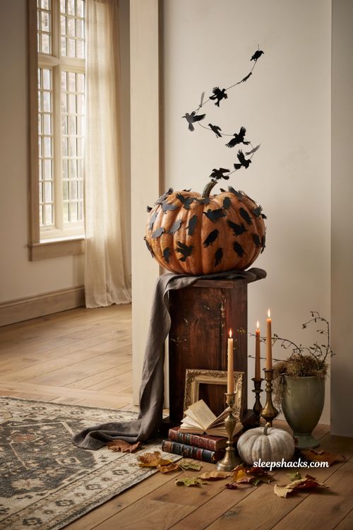 Pumpkin decorating ideas for contest with dramatic murder of crows pumpkin in gothic farmhouse fall decor