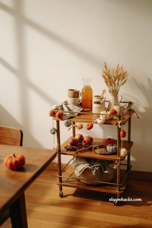 Pumpkin garland on bar cart for cozy fall decor