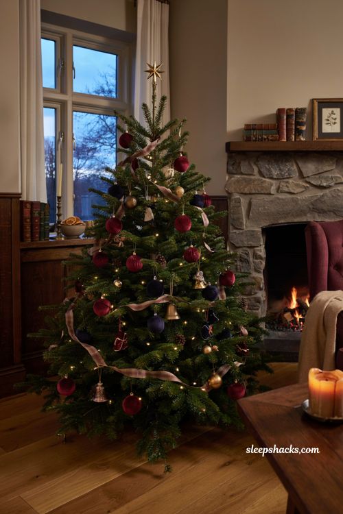 Ralph Lauren Christmas tree with deep red and navy velvet ornaments and tartan ribbon 