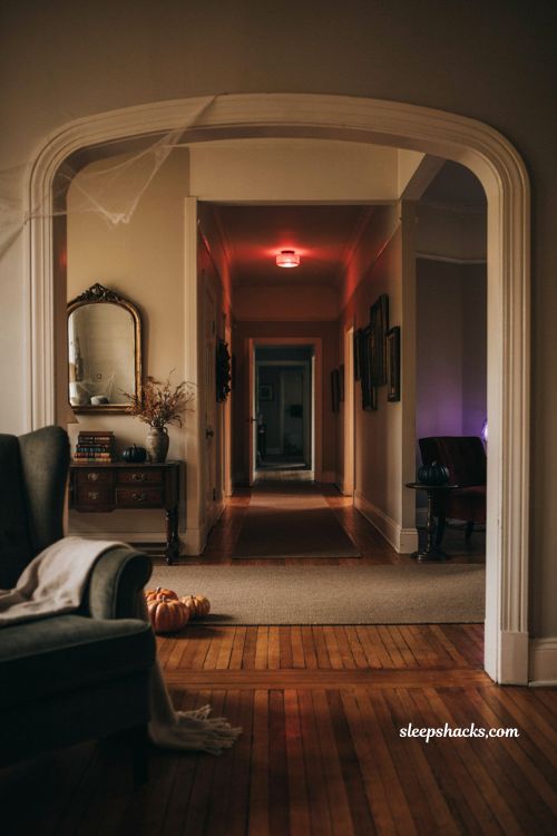 Red and purple light bulbs for cozy Halloween house party atmosphere
