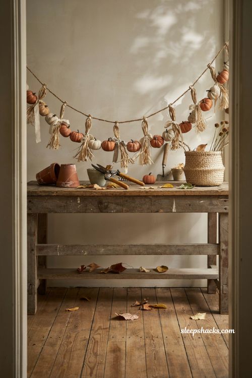 Rustic pumpkin garland with raffia for farmhouse fall decor