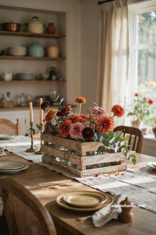 Rustic wooden crate centerpiece with mums dahlias and dried eucalyptus for vintage fall decor