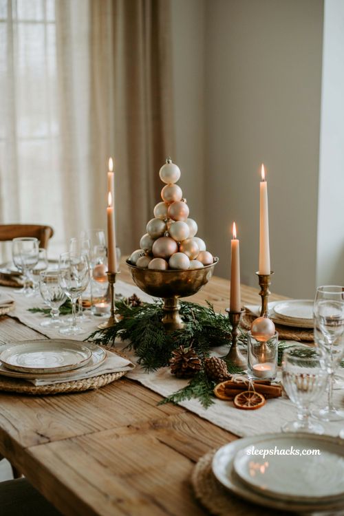 Simple christmas centerpieces for table with ornament pyramid on a brass compote