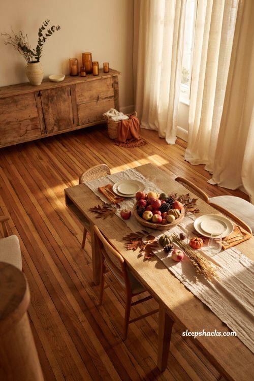 Simple fall dining table centerpiece with apples gourds and natural autumn decor