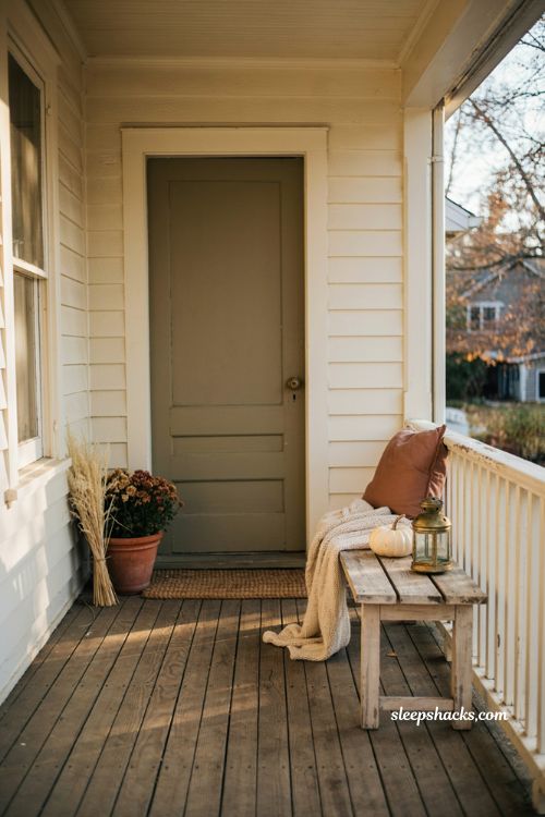 Simple fall front porch ideas with slim bench cozy throw pumpkin and lantern 