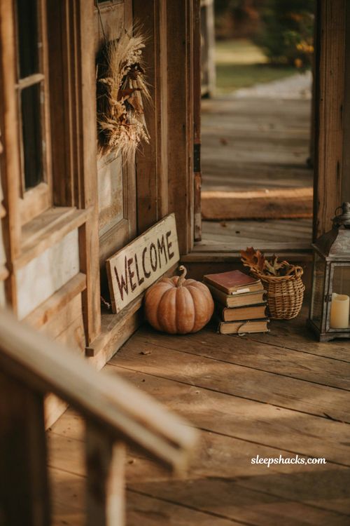 Simple small front porch fall decor with rustic wooden welcome sign
