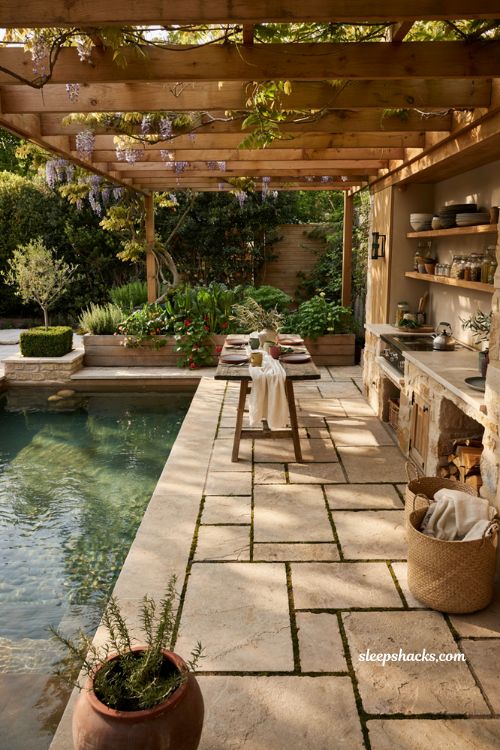 Small natural pool with covered outdoor dining area and kitchen garden retreat