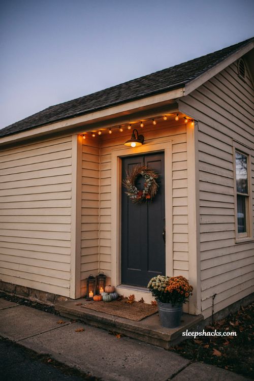 Small porch halloween decor with warm lighting