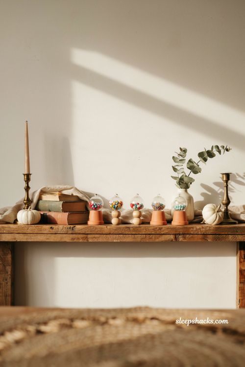 Small pumpkin decorating ideas with mini pumpkin gumball machine mantel decor