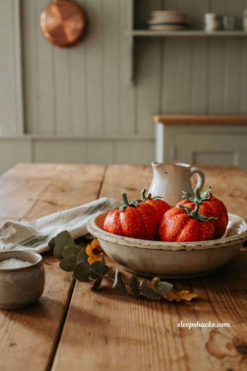 Small pumpkin decorating ideas with strawberry painted mini pumpkins in a cozy farmhouse fall centerpiece