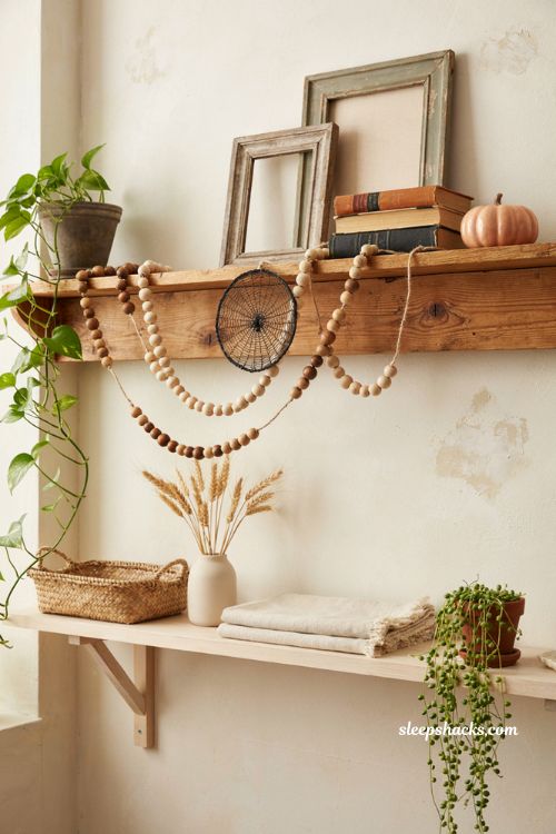Spiderweb wooden bead Halloween garland on a rustic farmhouse mantel 
