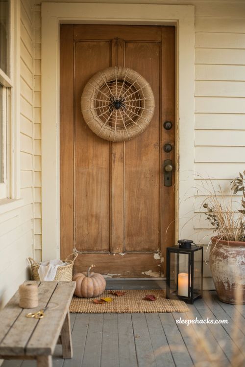 Spiderweb wreath with twine and black spider for cozy DIY Halloween door decor