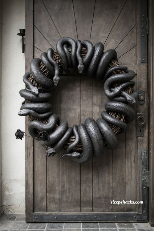 Spray painted snake wreath with black rubber snakes gothic Halloween door decor 