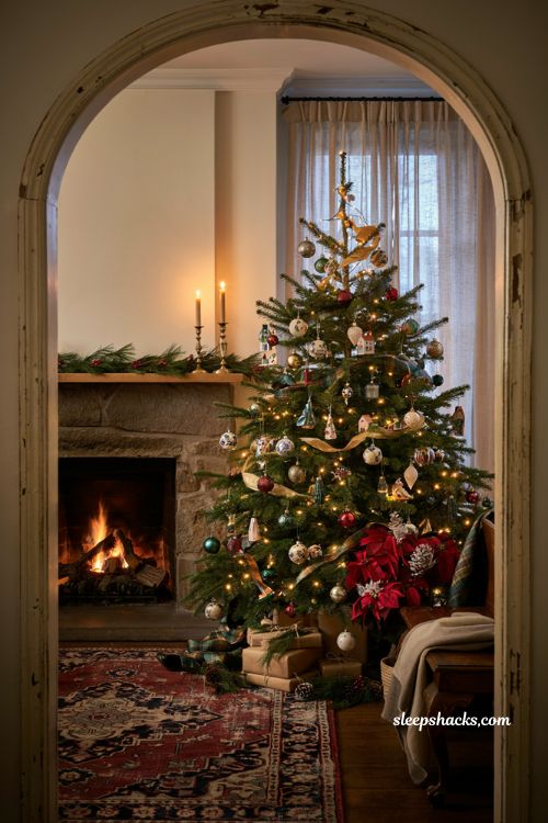 Stunning mismatched vintage and modern statement christmas tree in a cozy farmhouse entryway