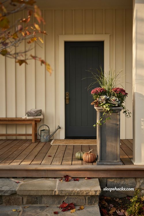Tall column planter with adjustable height and elegant fall flowers