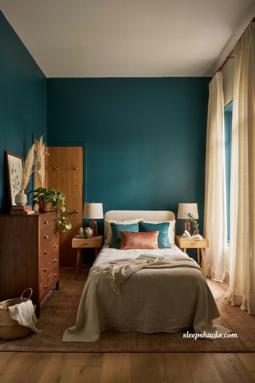 Teal and copper bedroom with copper hardware and elegant fixtures