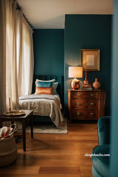 Teal and copper bedroom with gold accents and elegant metallic decor