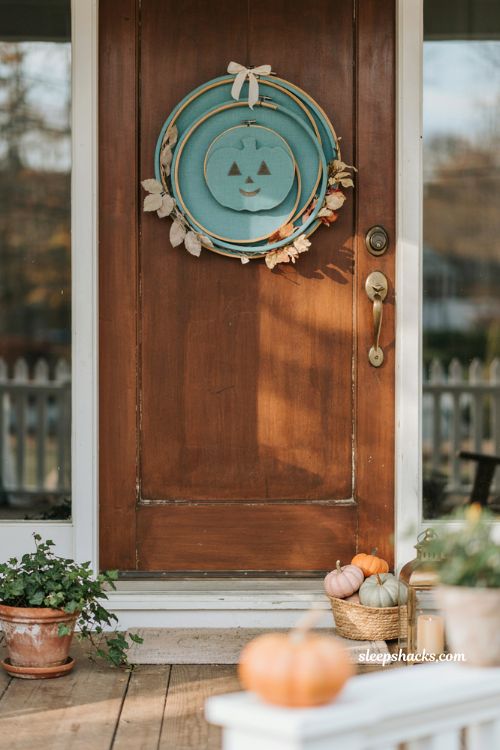 Teal pumpkin Halloween wreath with pastel fabric hoops and friendly entryway decor