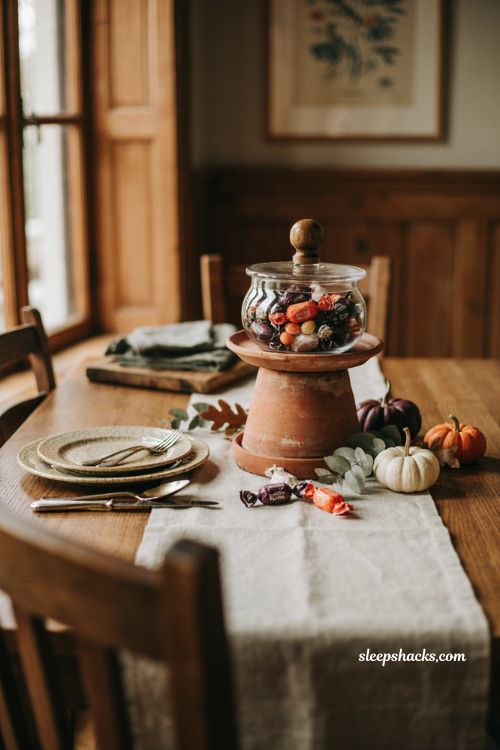 Terracotta candy jar centerpiece for an elegant Halloween table