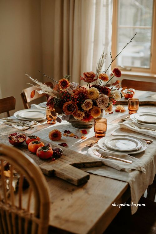 Thanksgiving flower arrangement ideas with warm red orange and cream flowers 