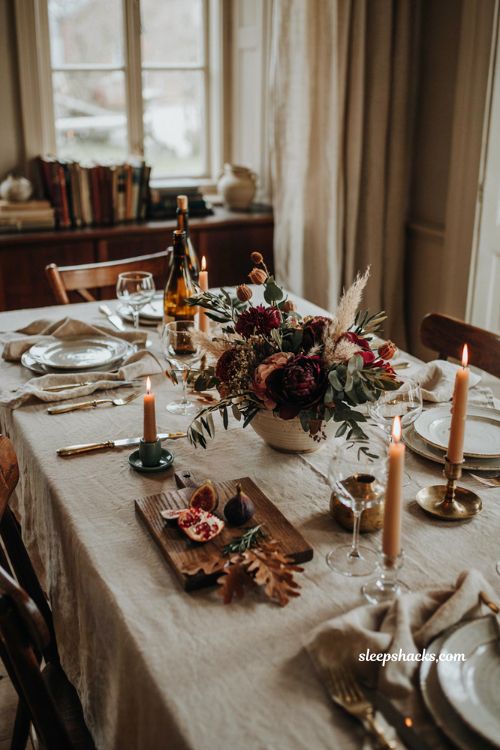 Thanksgiving tablescapes with jewel toned floral centerpiece 