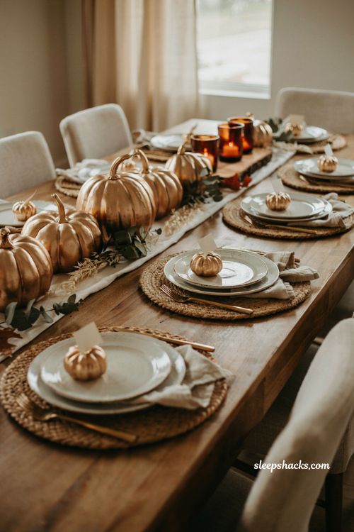 Thanksgiving tablescapes with metallic gold pumpkins and place cards 
