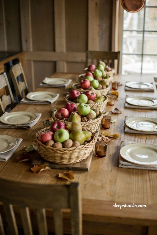 Thanksgiving tablescapes with woven harvest baskets and fruit centerpiece 