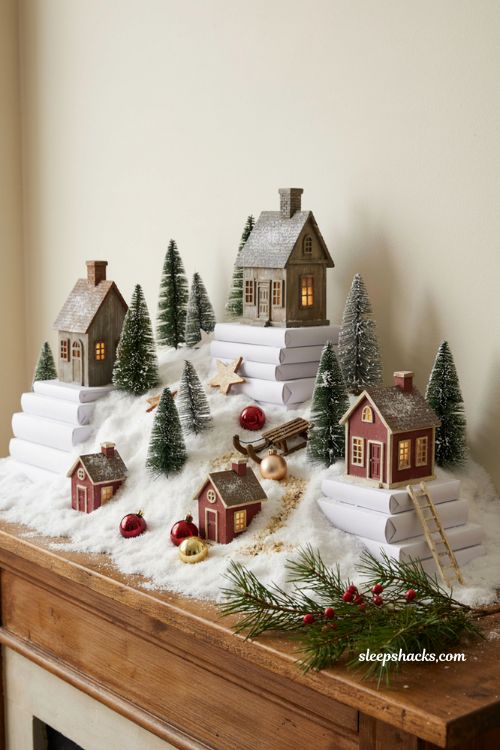 **Title** christmas village display ideas diy using stacked books as hidden risers 
