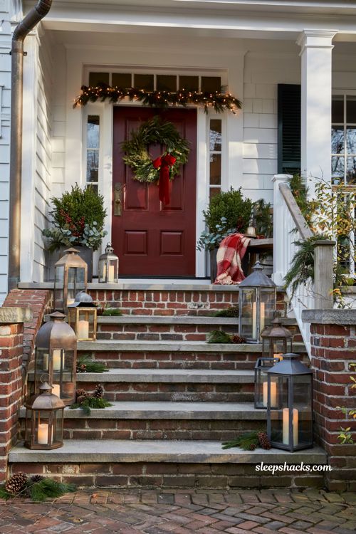 Traditional christmas porch decor with lantern lined steps and classic holiday entry styling