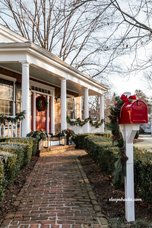 Traditional christmas porch decor with mailbox garland and matching holiday wreath accents