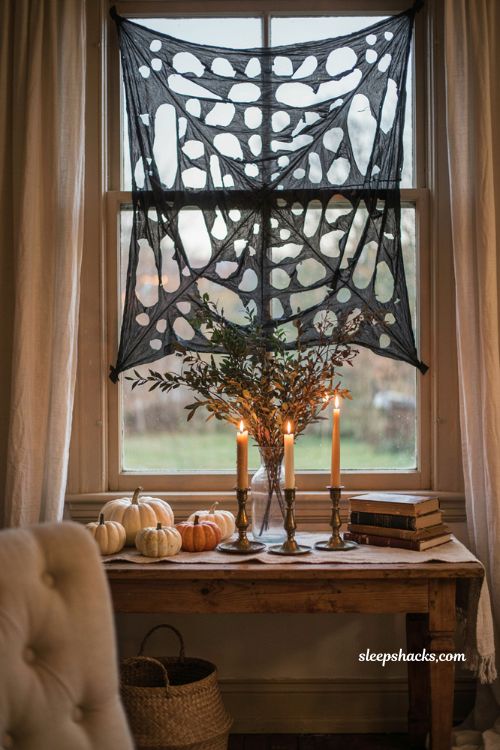 Trash bag spider web window decoration for easy DIY Halloween decor