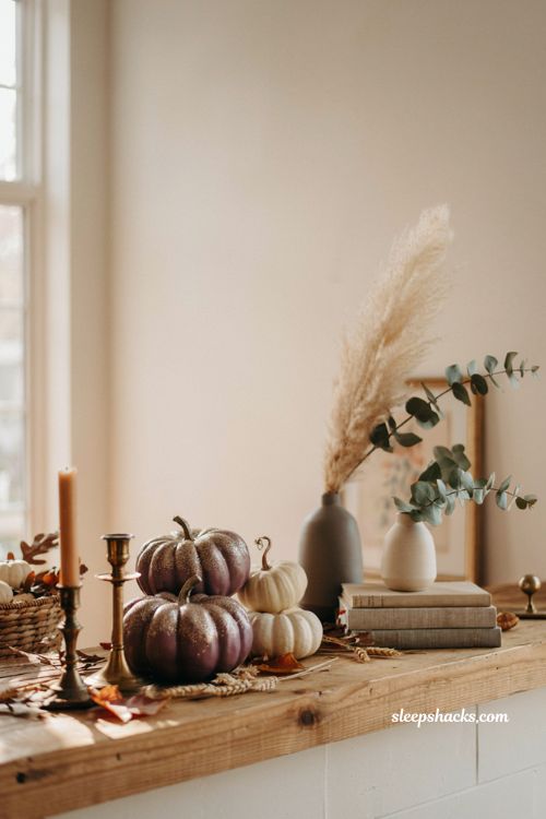 Unique pumpkin decorating ideas with glitter ombre pumpkins for elegant fall mantel decor
