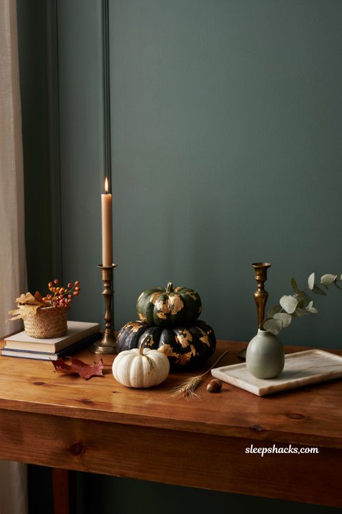 Unique pumpkin decorating ideas with gold leaf accent pumpkins for elegant fall home decor
